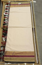 Kerala Saree with Blouse - Flat lay showing gold, maroon and black border with tassel detail