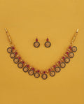 Temple coin necklace and earring set on yellow background
